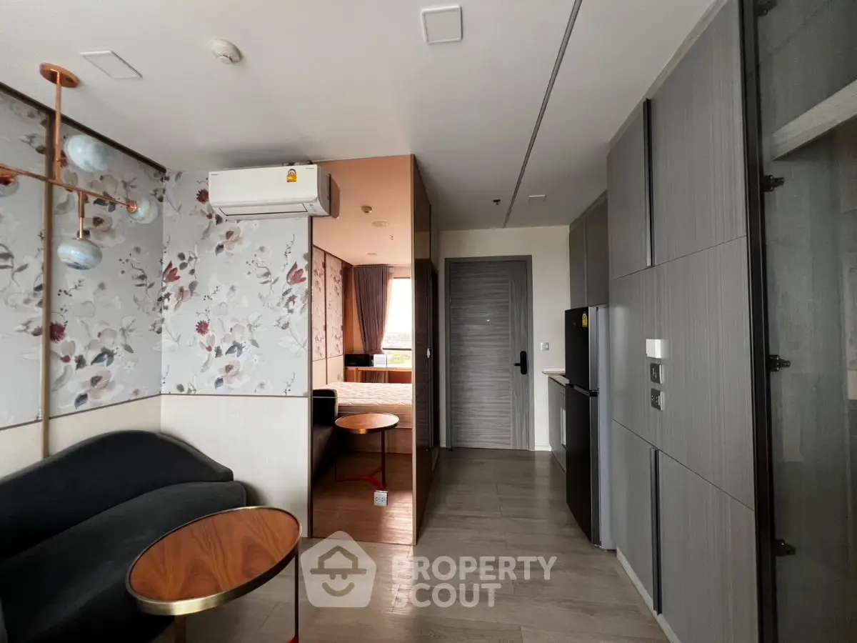 Modern apartment interior with stylish living area and compact kitchen