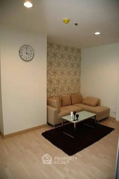 Cozy living room with modern beige sofa and stylish decor
