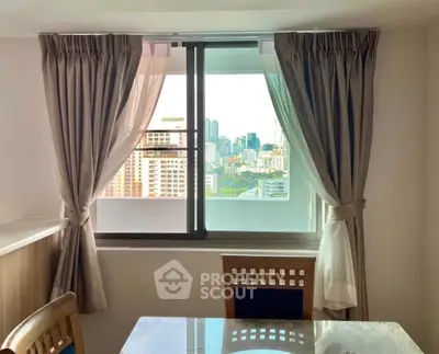 Bright dining area with city view through large window, elegant curtains, and wooden chairs.