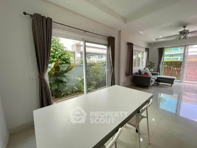 Spacious living room with garden view and modern decor