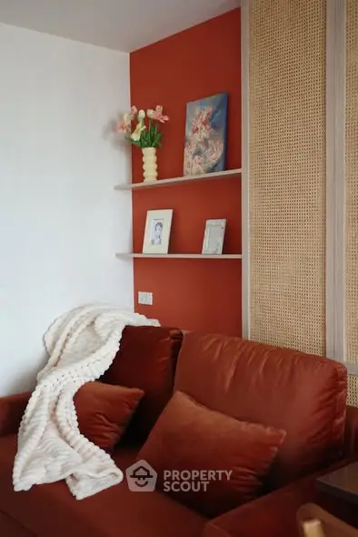 Cozy living room with plush sofa and decorative shelves