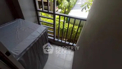 Cozy balcony with garden view, perfect for relaxation and enjoying fresh air.