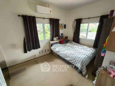 Cozy bedroom with natural light and modern decor