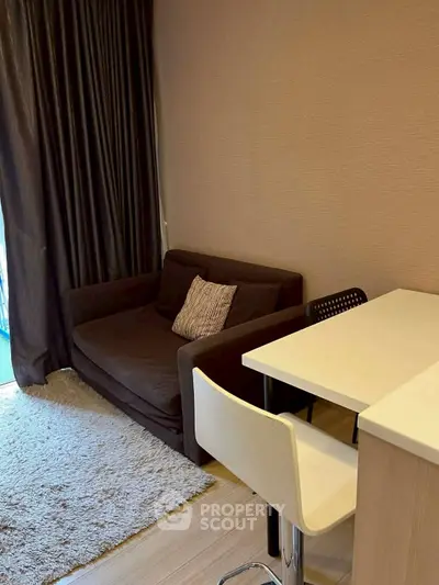 Cozy living room with modern sofa and breakfast bar in stylish apartment.