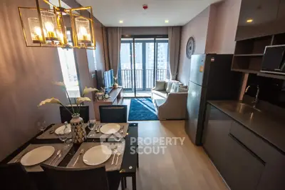 Modern open-layout living room with dining area and balcony view in a stylish apartment.