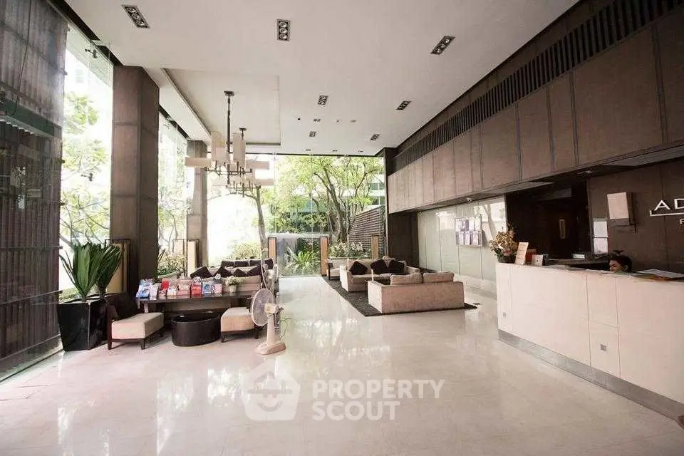 Luxurious modern lobby with elegant seating and lush greenery