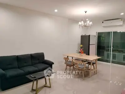 Modern living room with elegant dining area and sleek furniture