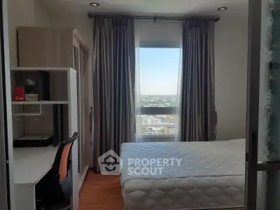 Bright bedroom with city view, modern furniture, and ample natural light.