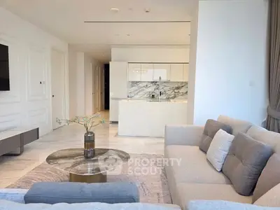 Luxurious open-plan living room with modern kitchen and elegant decor