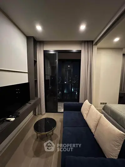 Modern living room with cozy sofa and city view balcony in luxury apartment