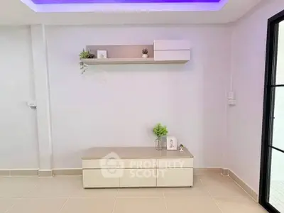 Modern minimalist living room with sleek furniture and ambient lighting