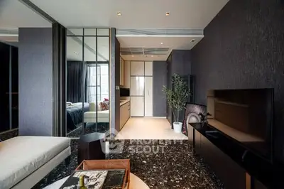 Modern living room with sleek design and open kitchen layout