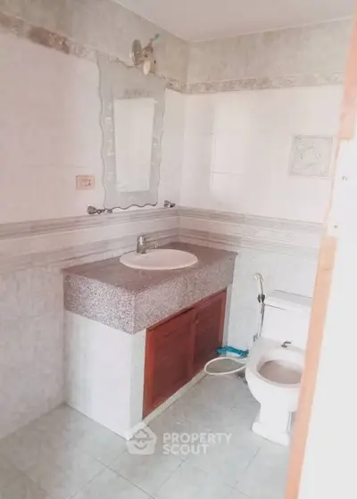 Spacious bathroom with elegant vanity and modern fixtures