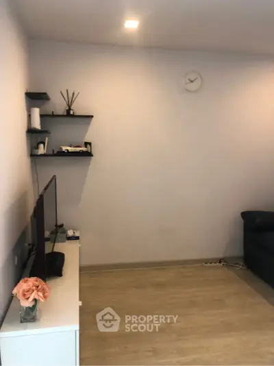 Modern minimalist living room with sleek shelves and stylish decor