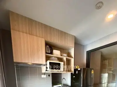 Modern kitchen with sleek cabinetry and stainless steel appliances
