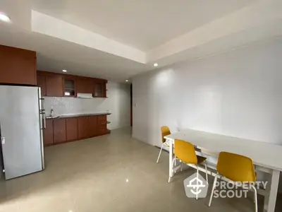 Spacious kitchen with dining area and modern appliances in open layout