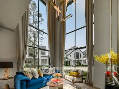 Luxurious living room with floor-to-ceiling windows and elegant decor