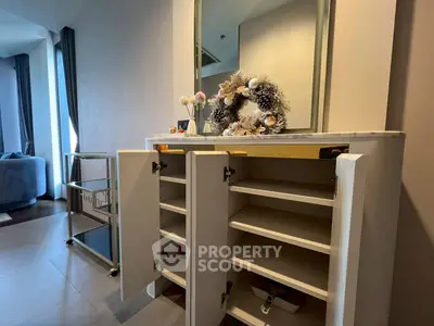 Modern interior with stylish cabinet and decorative mirror in a cozy living space.