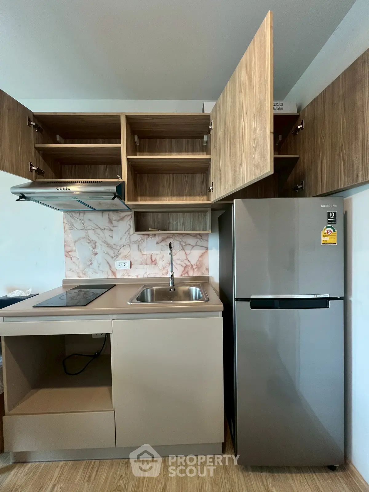 Modern kitchen with open cabinets and stainless steel appliances