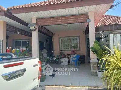 Charming single-story home with tiled roof and spacious front porch