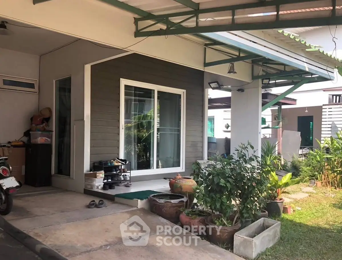 Charming suburban home with covered porch and lush garden, perfect for family living.