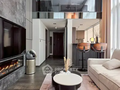 Modern living room with sleek fireplace and stylish bar stools