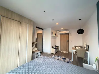 Modern bedroom with stylish decor and workspace in a cozy apartment