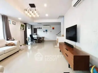 Spacious modern living room with stylish lighting and sleek furniture