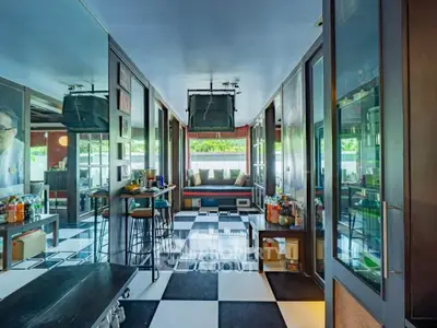 Stylish modern living room with checkered floor and cozy seating area