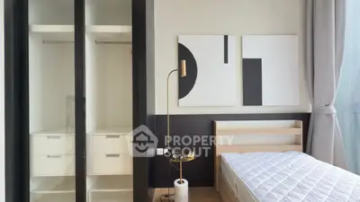 Modern bedroom with minimalist decor and built-in closet