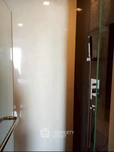 Modern bathroom with sleek shower design and glass door