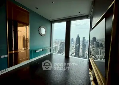 Luxurious high-rise apartment with stunning city view and modern interior design.
