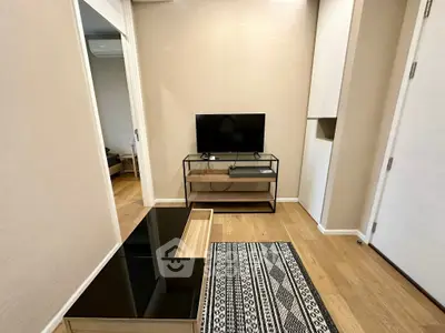 Modern living room with sleek TV stand and stylish rug