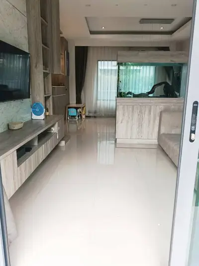 Modern living room with sleek design and large windows for natural light