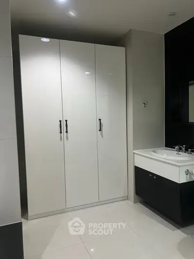 Modern bathroom with sleek cabinetry and stylish sink design