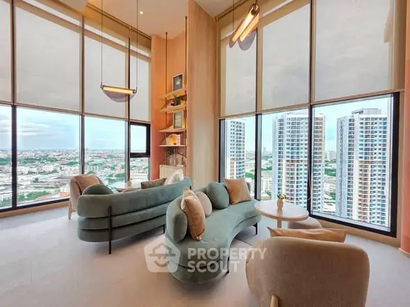 Luxurious high-rise living room with panoramic city views and elegant modern furniture.