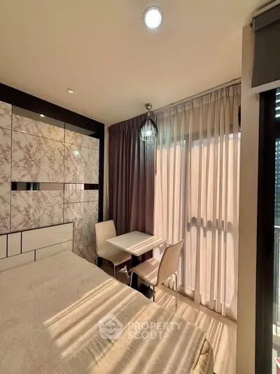 Modern bedroom with elegant decor and natural light in a stylish apartment