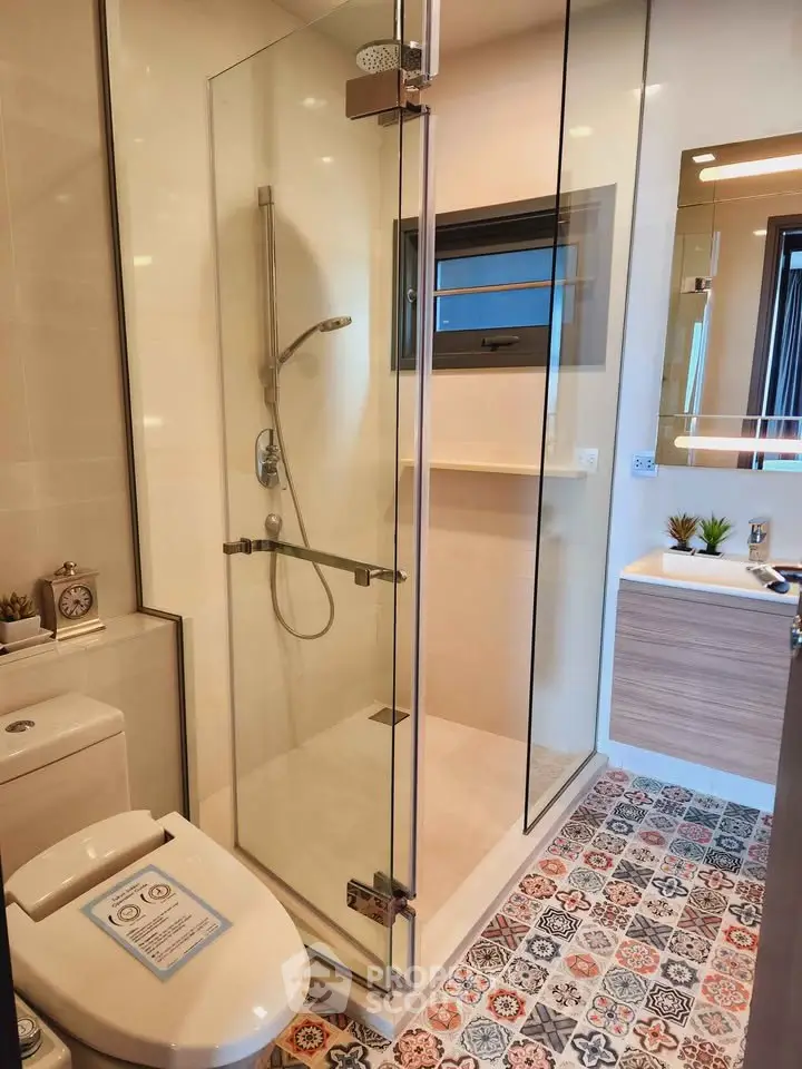 Modern bathroom with glass shower and stylish tile flooring