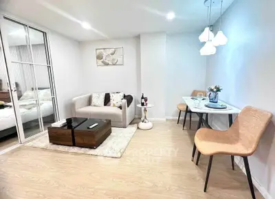 Modern living room with cozy seating and elegant dining area