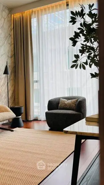 Elegant living room with floor-to-ceiling windows and modern furniture