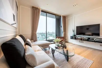 Luxurious living room with modern decor and stunning city view from large windows.