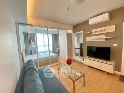 Modern living room with glass partition and stylish decor