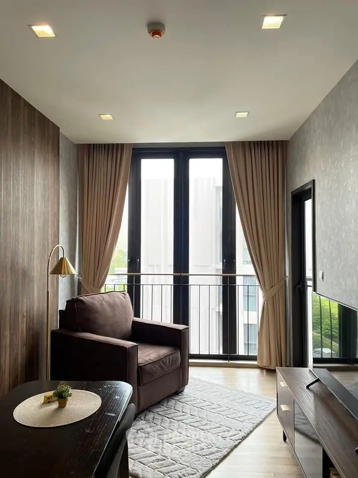 Modern living room with large windows and elegant decor