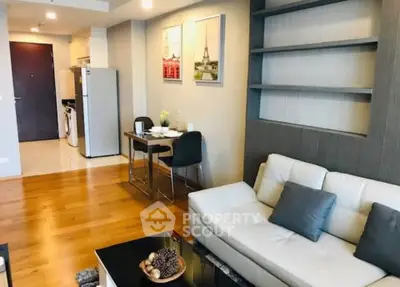 Modern living room with stylish decor, open layout, and cozy dining area in a contemporary apartment.
