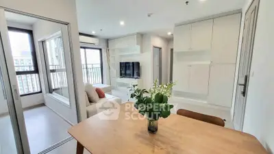 Modern living room with open layout and stylish decor in a bright apartment