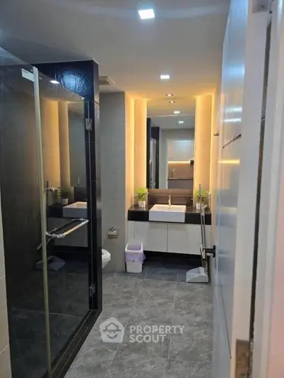 Modern bathroom with sleek design and ambient lighting