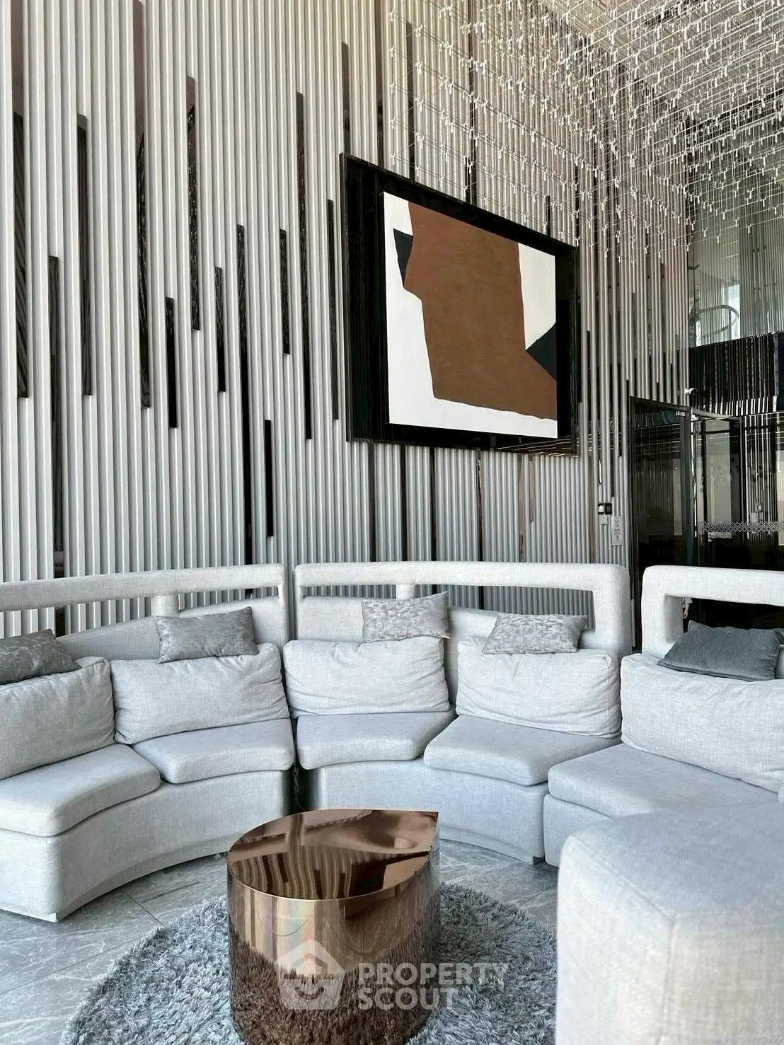 Luxurious modern living room with unique art and plush seating