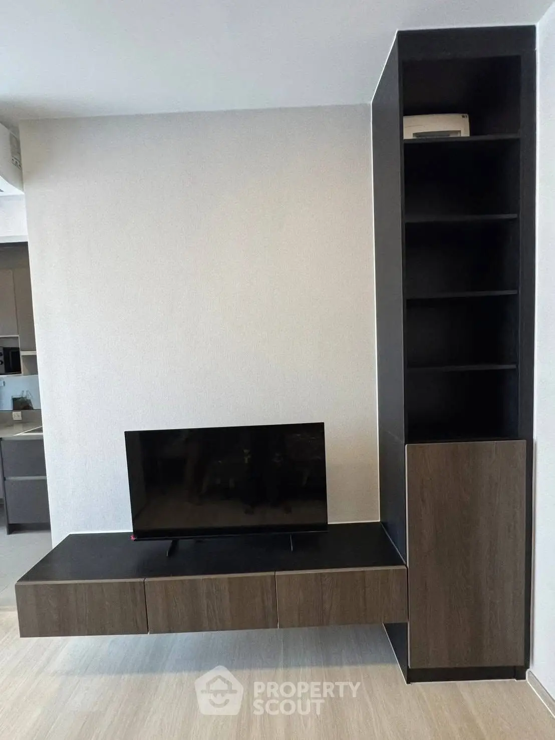 Modern living room with sleek TV unit and open shelving