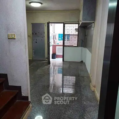 Spacious entryway with polished floors and ample natural light