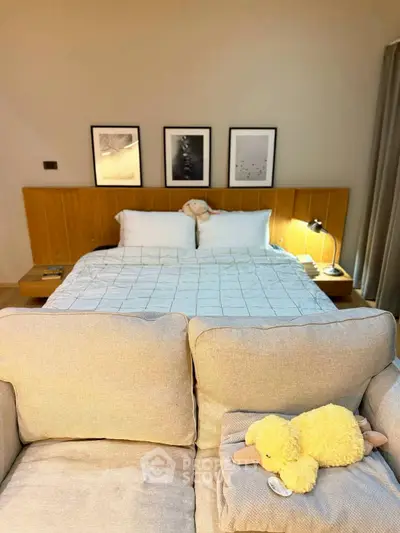 Cozy bedroom with stylish decor and plush bedding, perfect for relaxation and comfort.